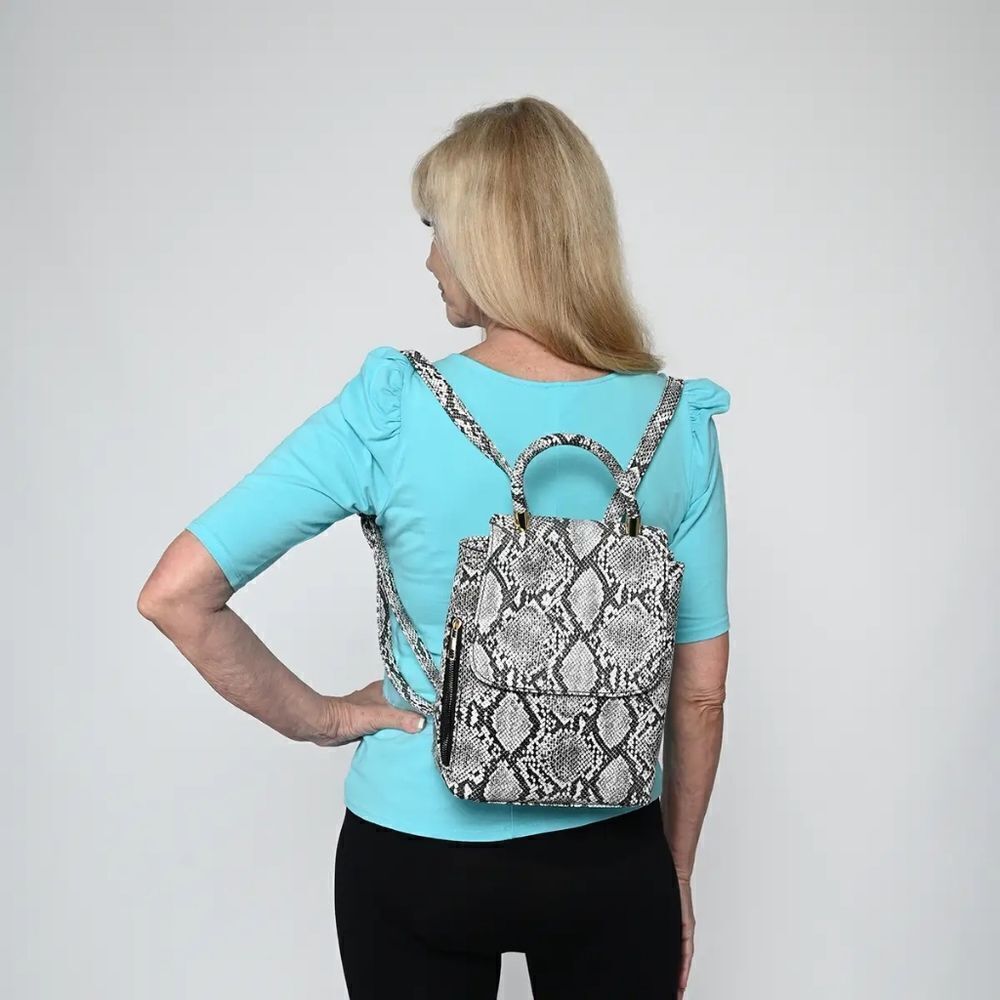 Le Chateau Black & White Snake Print Backpack - like new never used